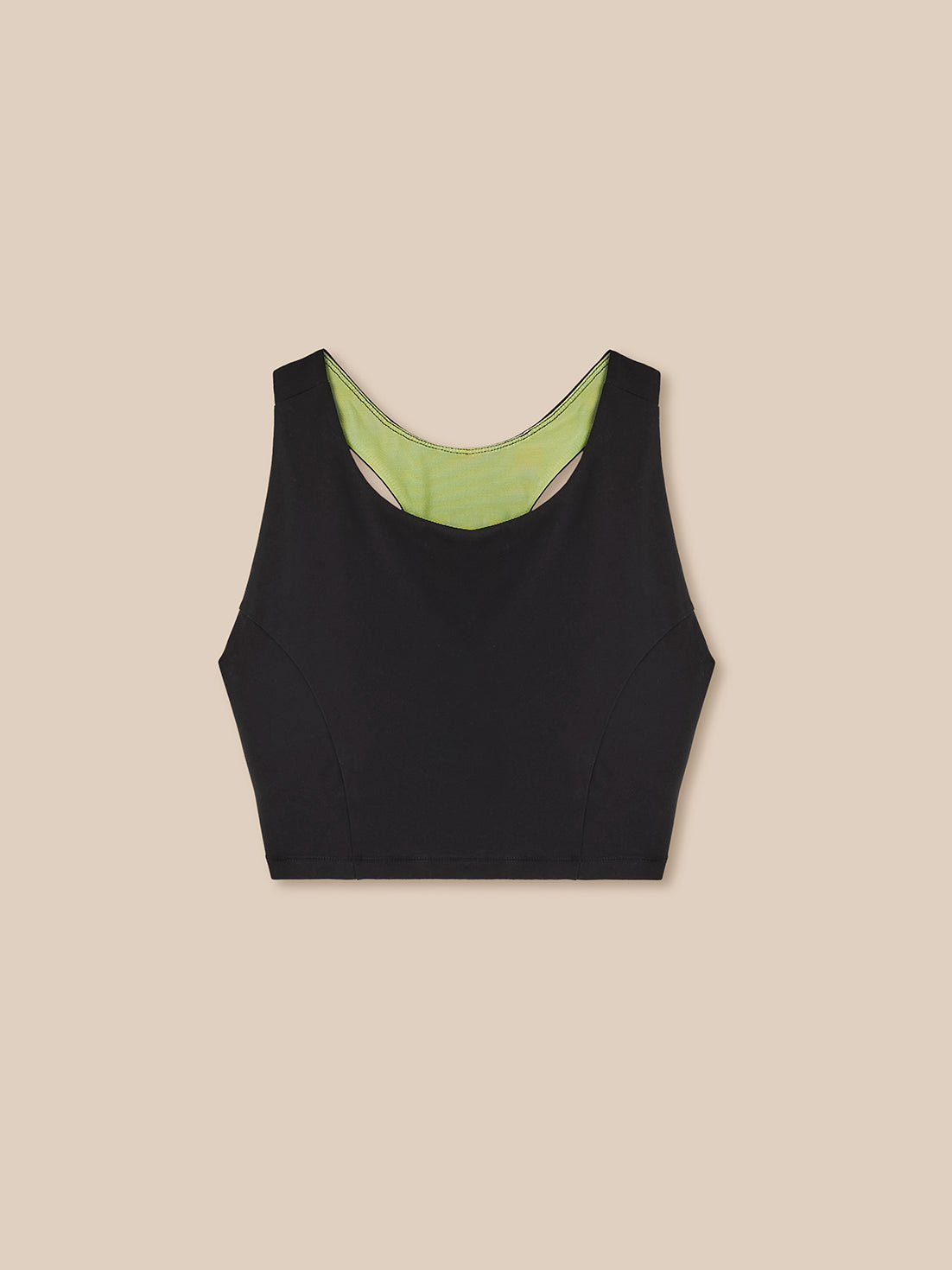 Black tank top with green lining on a beige background
