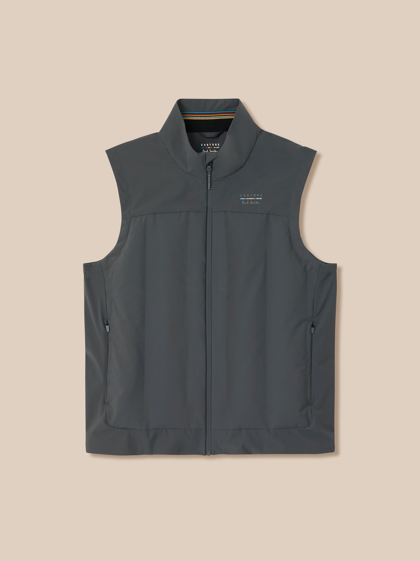 Dark gray vest with brand logo on a beige background