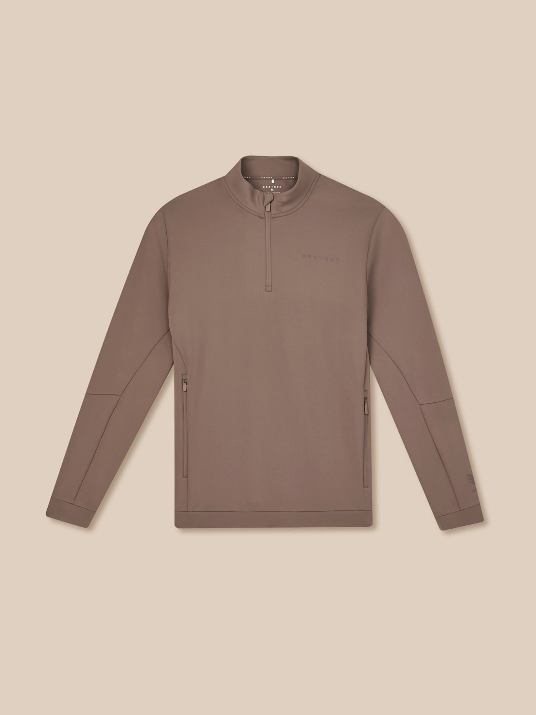 Brown long-sleeve shirt with a quarter zip on a beige background