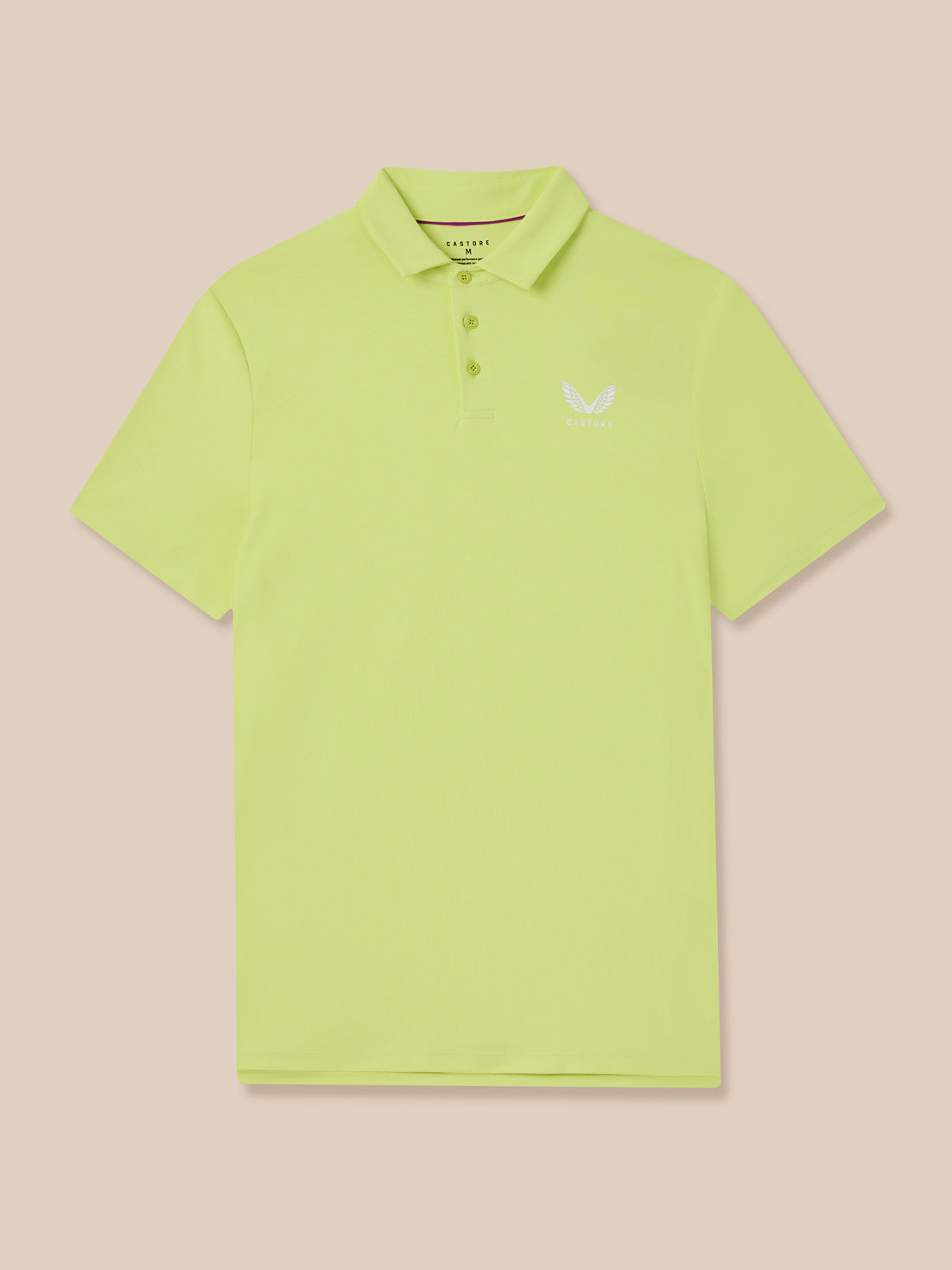 Light green polo shirt with a small Castore logo on a beige background