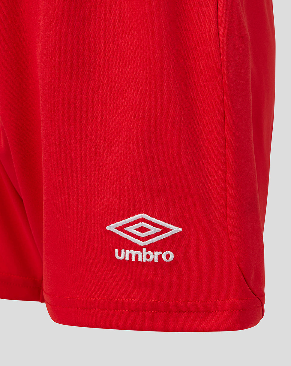 Red shorts with Umbro logo on a light gray background