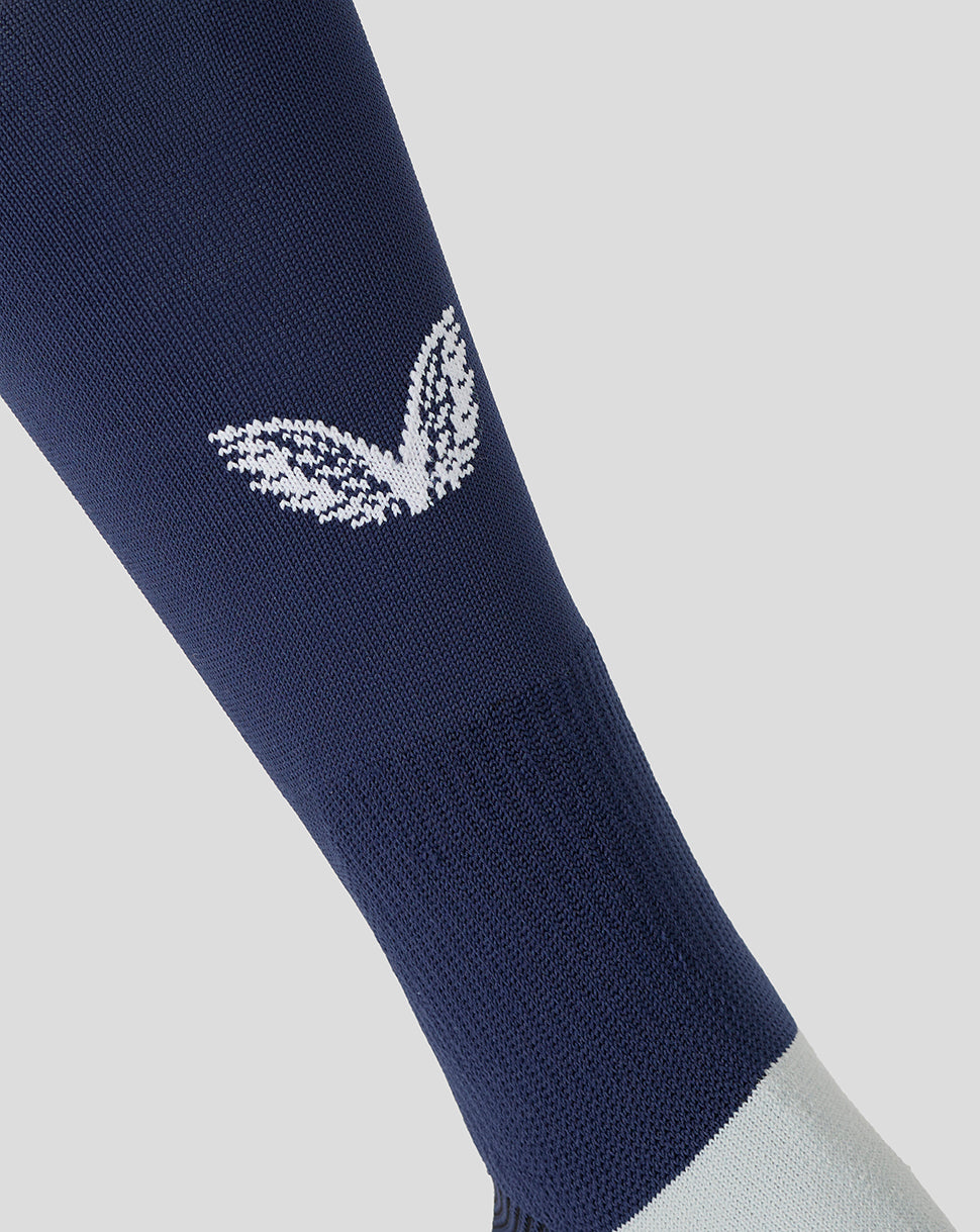 Navy sock with a white logo on a light gray background
