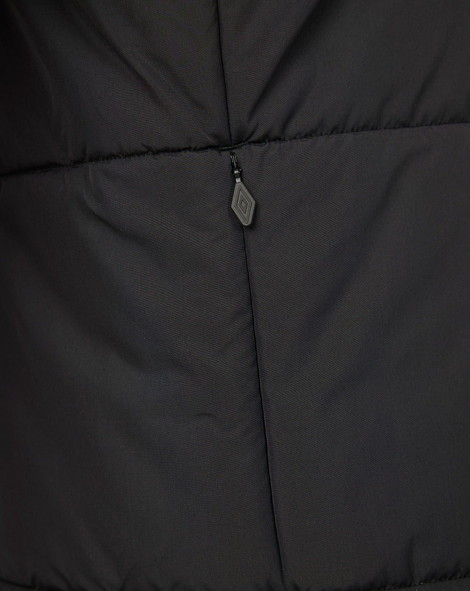 Close-up of a black puffer jacket with a zipper detail.