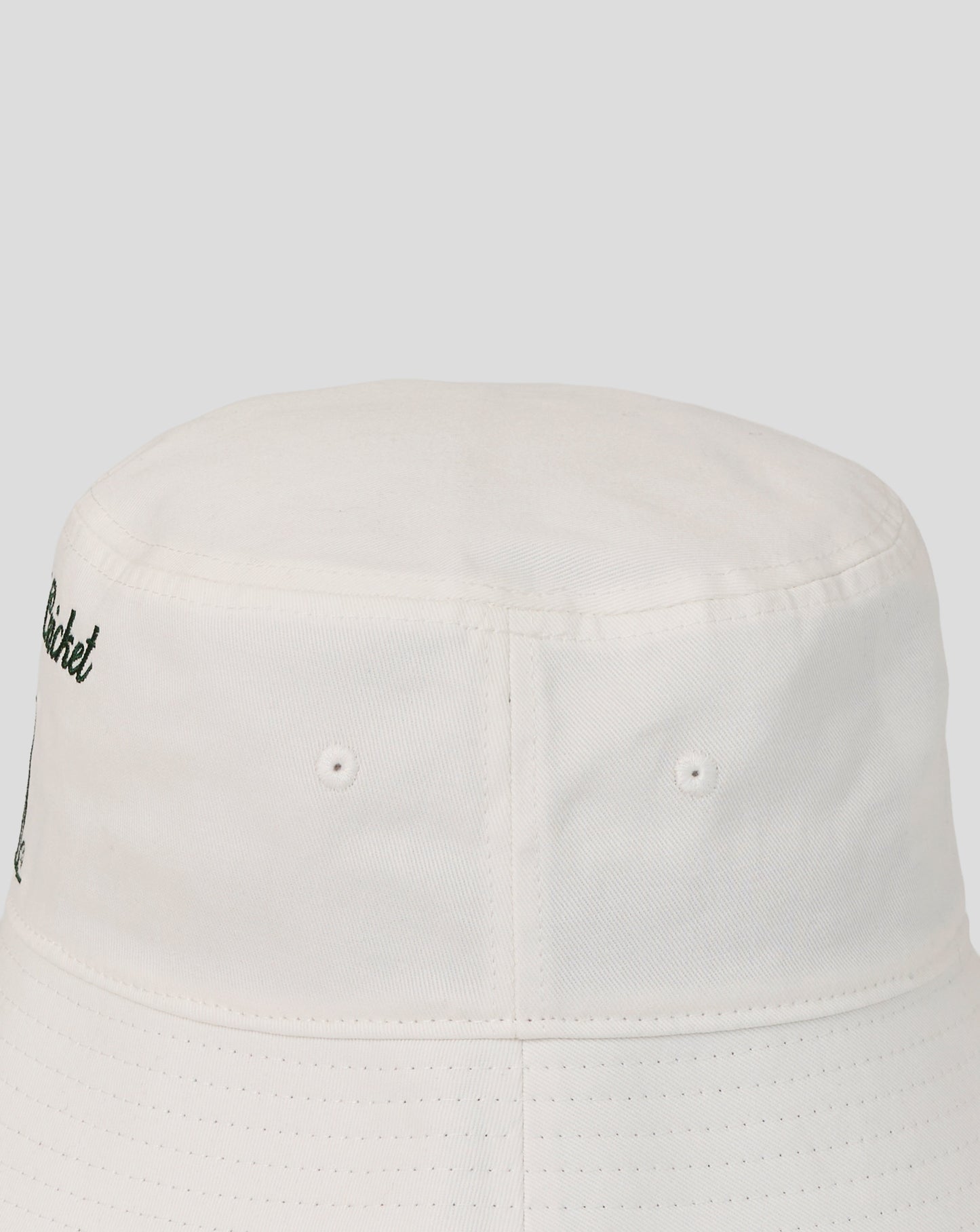 White bucket hat with a small logo on a white background