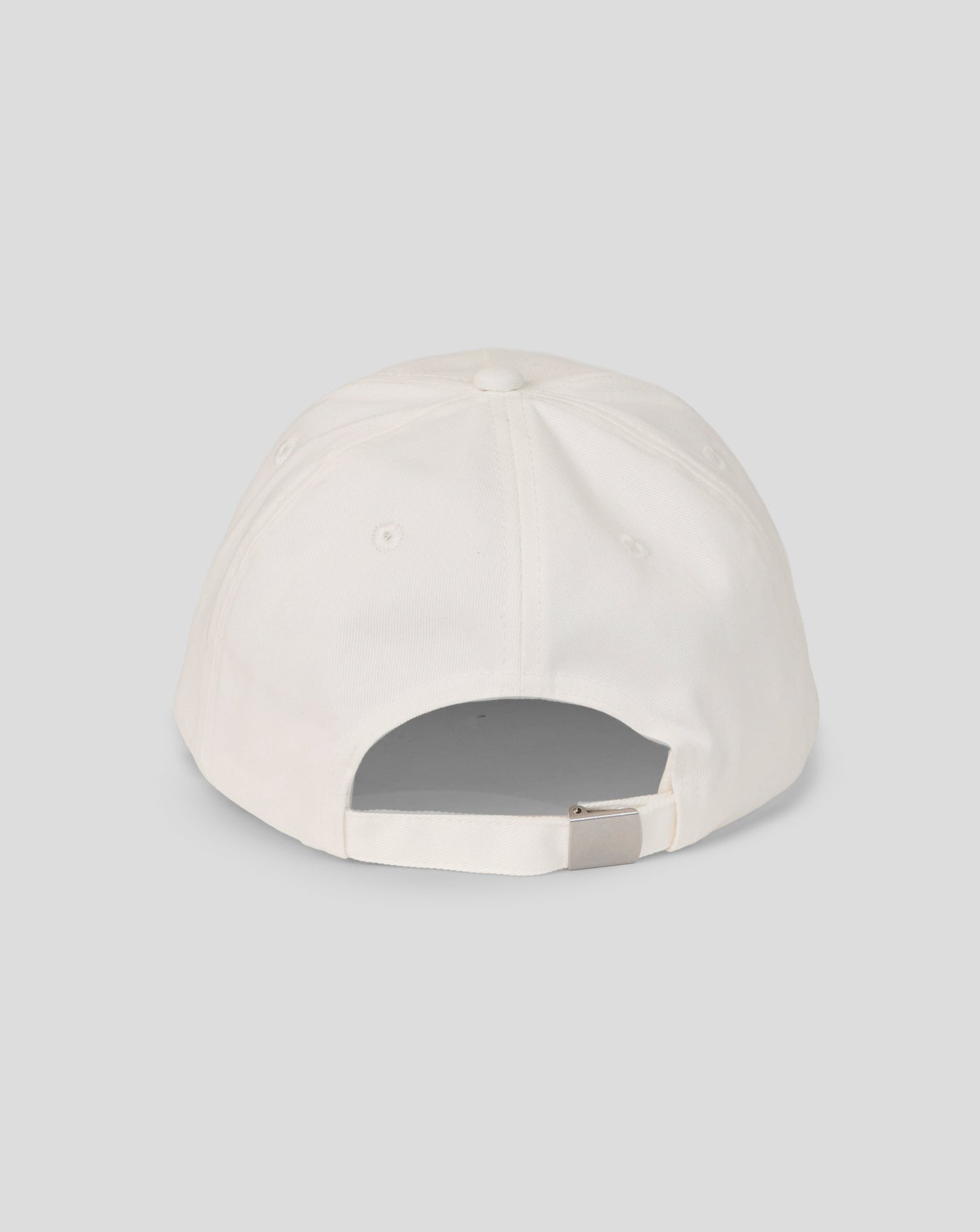 White baseball cap on a light gray background