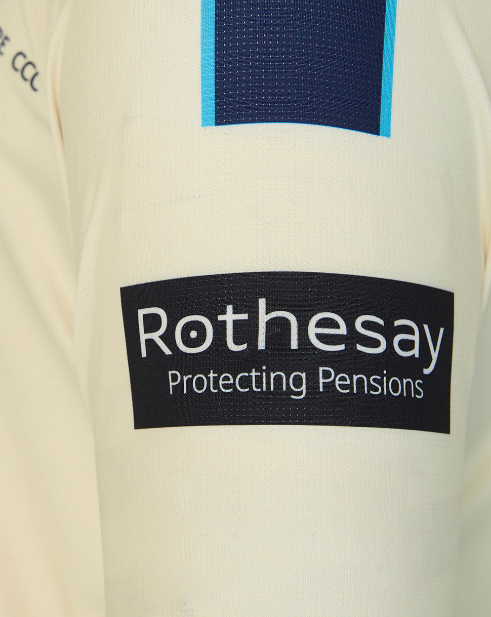 Close-up of a Rothesay logo on a beige background