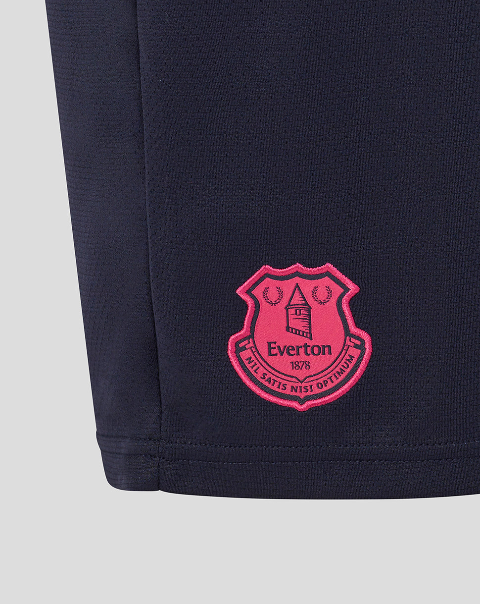 Navy shorts with a pink crest logo on a light gray background