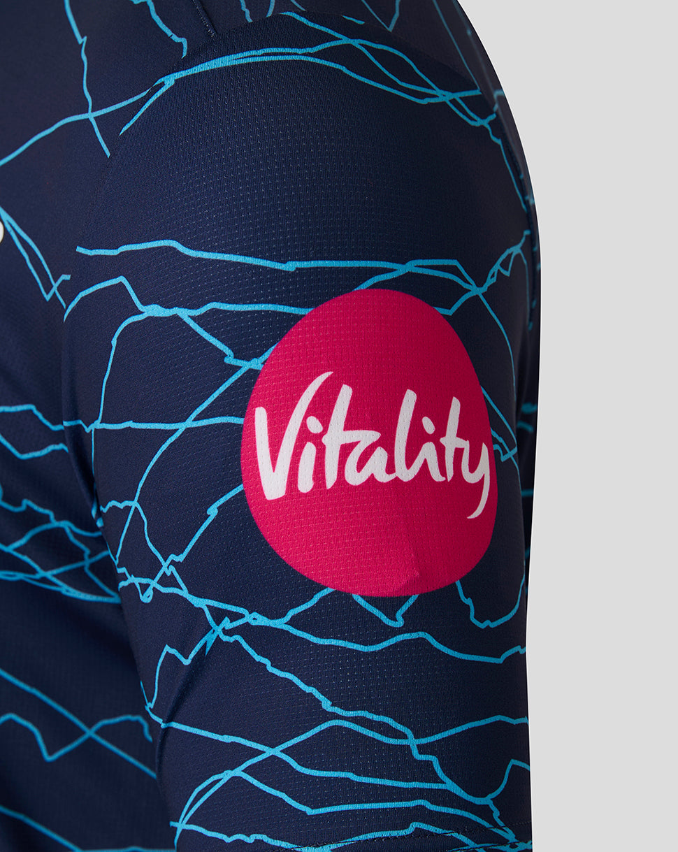 Navy blue athletic outfit with a red 'Vitality' logo on a gray background