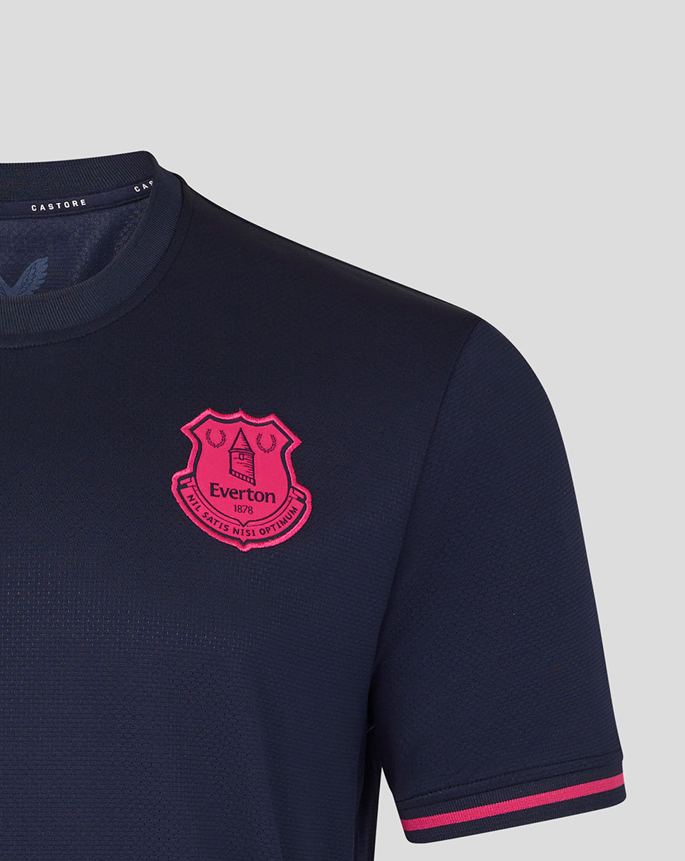 Navy blue shirt with a pink crest on a light gray background