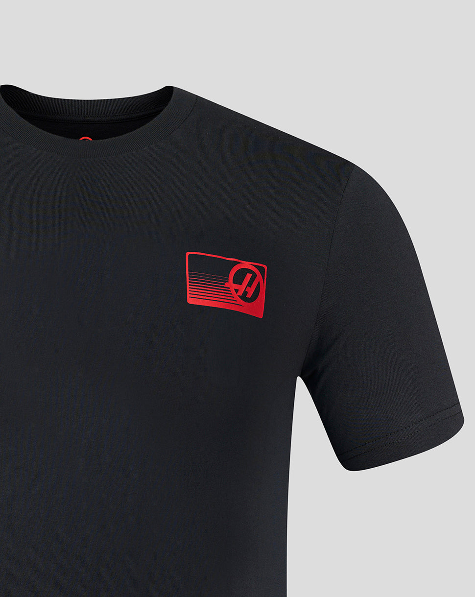 Black t-shirt with a red logo on a gray background