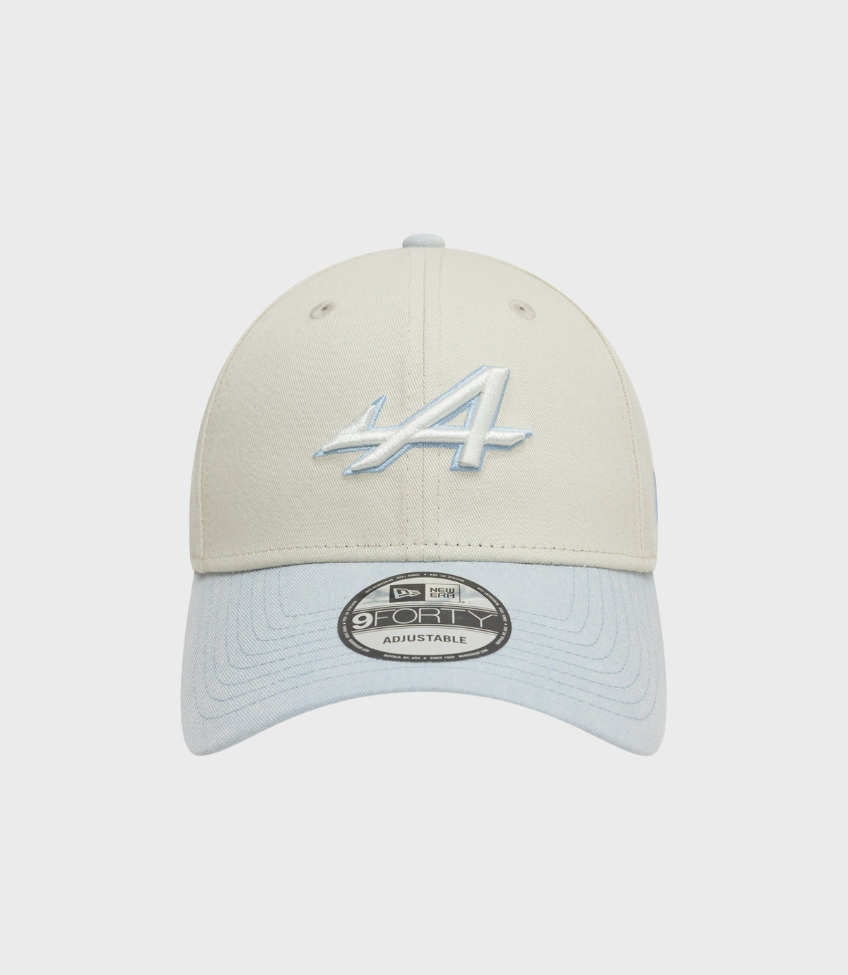 Front view of creme New Era Alpine Acid Wash 9Forty cap with light blue denim brim and pale blue embroidery on crown