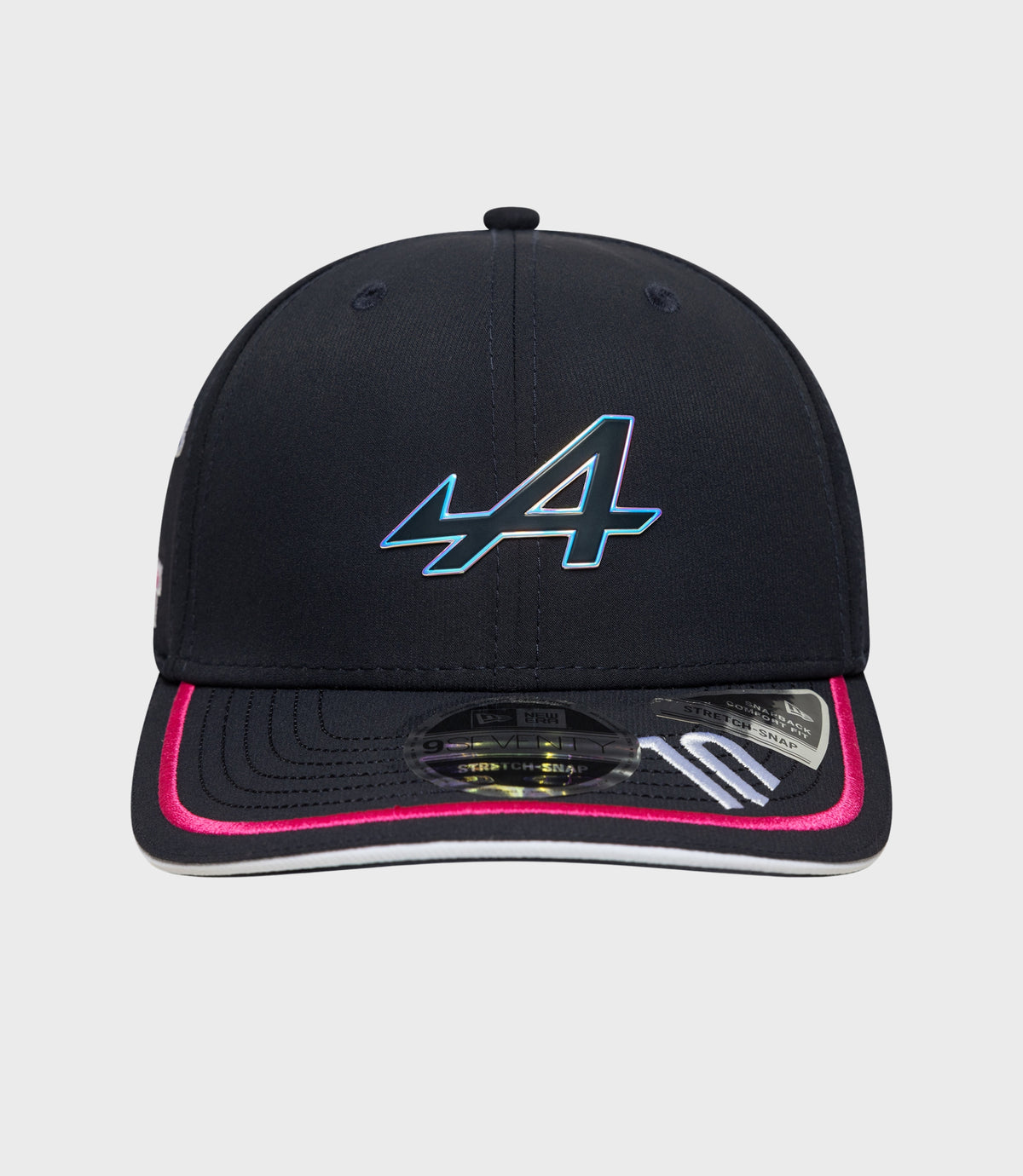 Close up of navy cap crown showing stitched panels and a small top button