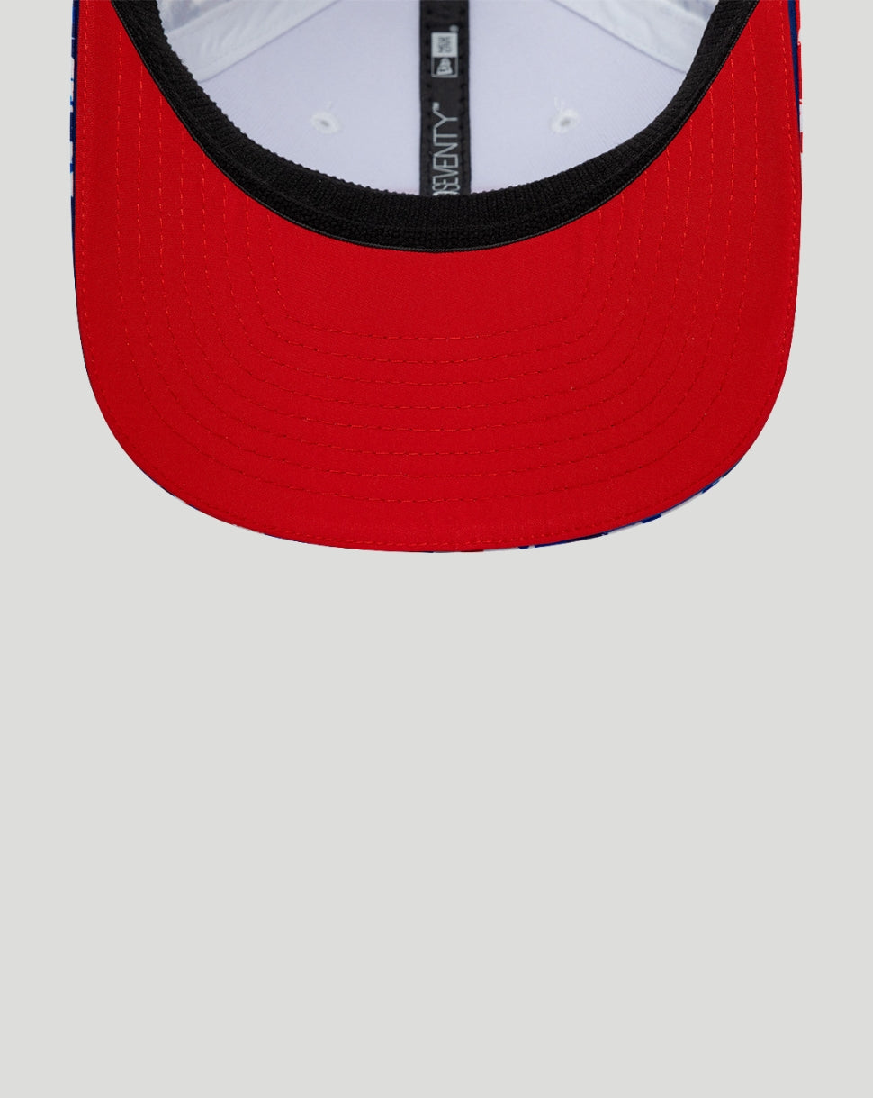 Red cap with a white interior and black rim on a light gray background