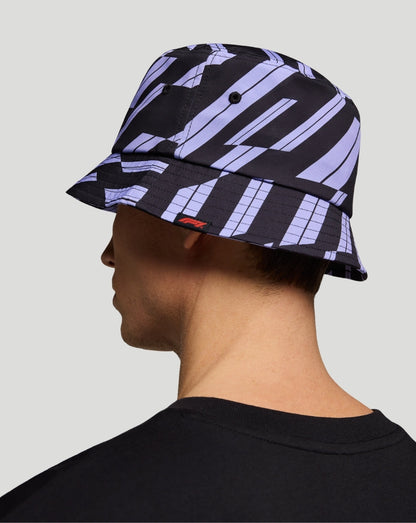 Side profile of the purple and black graphic bucket hat showing the brim on a model