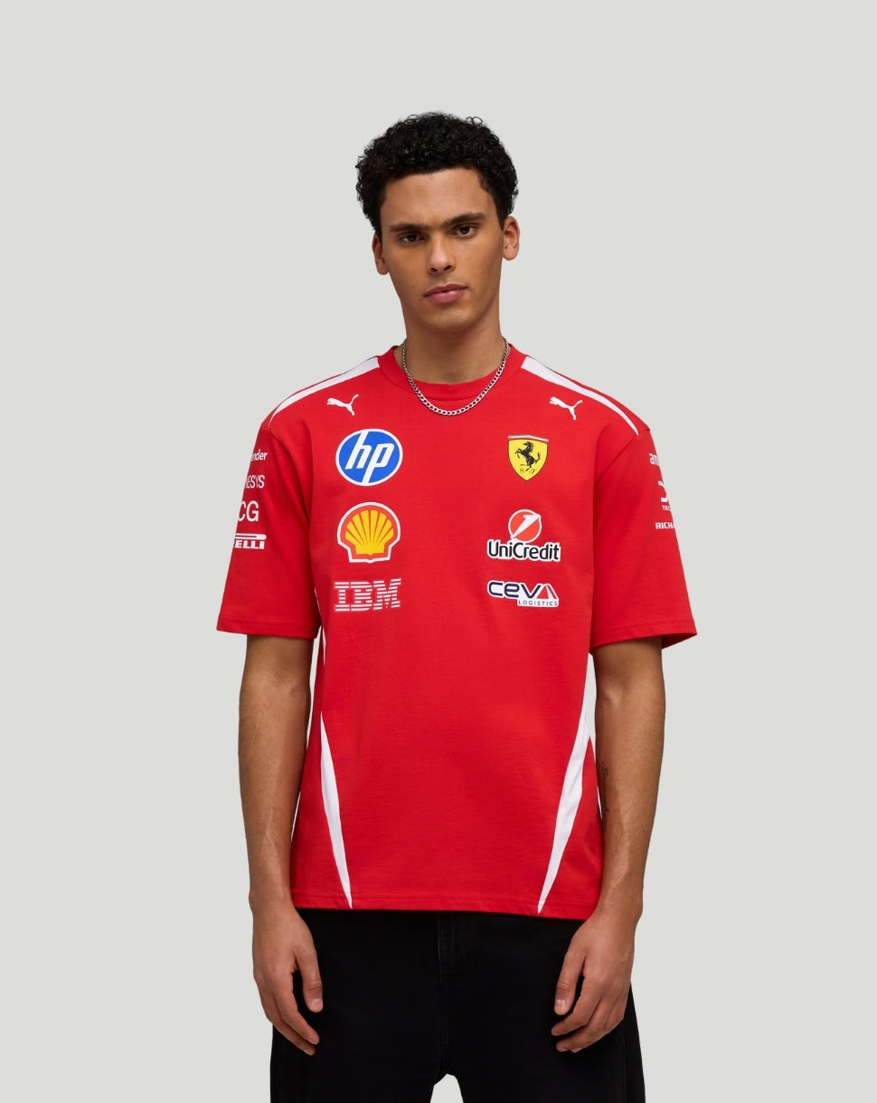 Front view of a model wearing red Scuderia Ferrari Team Drivers T Shirt with sponsor logos on the chest and white side panels.