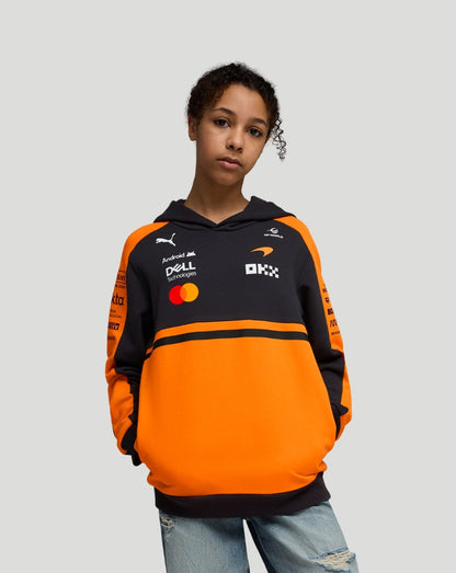 Child wearing Papaya McLaren Junior Team Hoodie orange and black with sponsor logos on chest