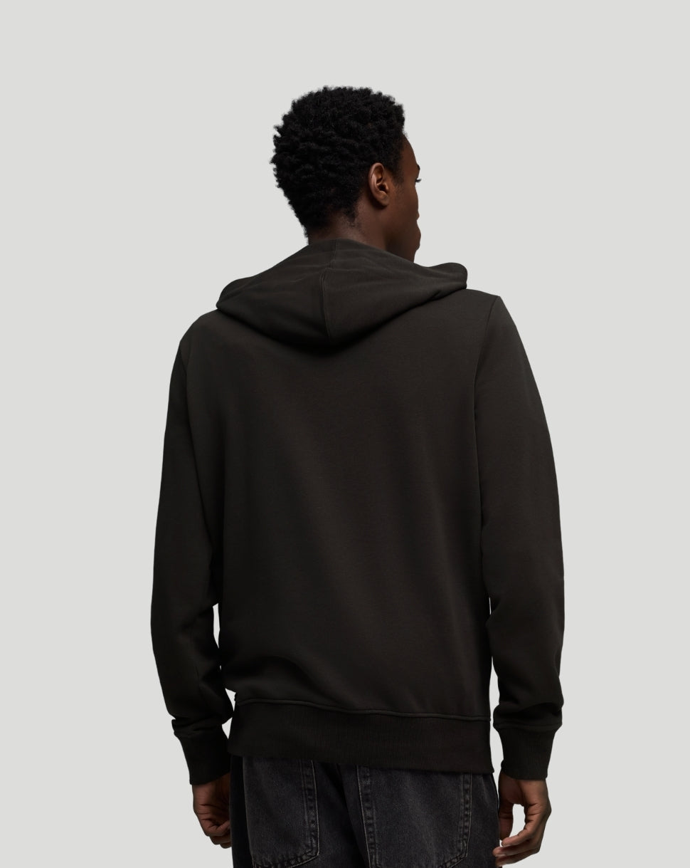 Back view of black McLaren hoodie on model showing hood and ribbed hem