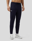 Male model in navy Flex Joggers with side branding and elastic cuffs
