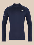 Man wearing navy Majesticks 1/4 Zip Top with stand collar and raglan sleeves, small Castore logo on chest.