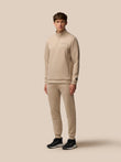 Male model wearing Mushroom Flex Lifestyle Joggers with matching top and black sneakers.