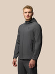 Male model wearing gunmetal Flex Classic Lifestyle Jacket with hood and zip pockets