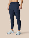 Model wearing Zone Training Trousers Midnight Navy with a tapered leg and drawcord waist