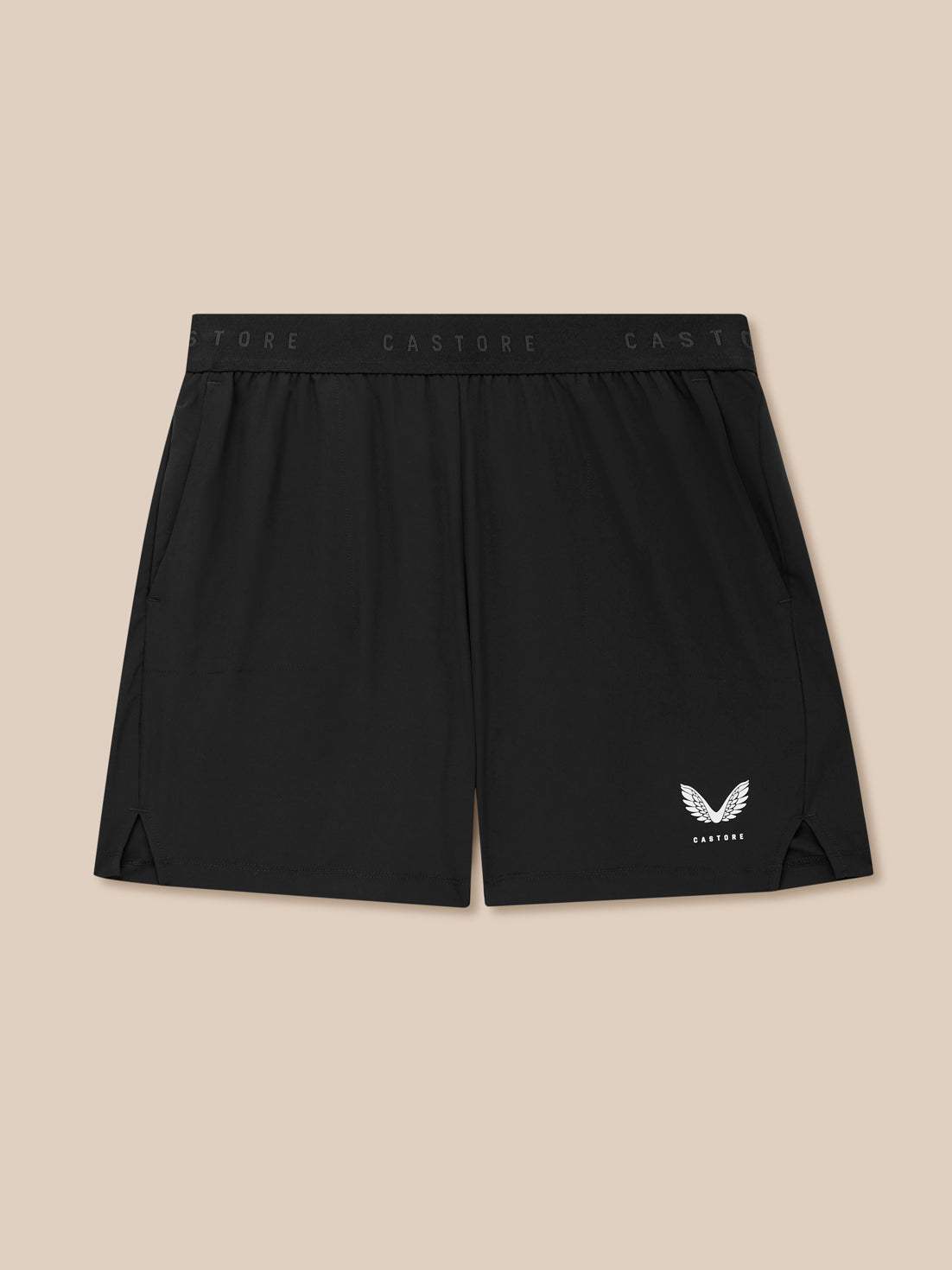 Black shorts with a logo on a beige background
