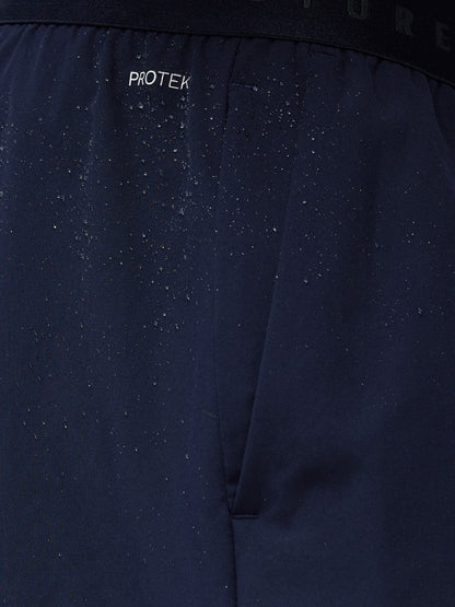 Close-up of a dark blue fabric with 'Protek' branding.