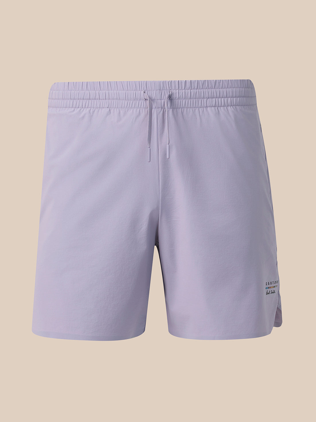 Light lavender athletic shorts with an elastic waistband and drawstring, shown against a solid beige background.