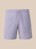 Light lavender athletic shorts with an elastic waistband and drawstring, shown against a solid beige background.