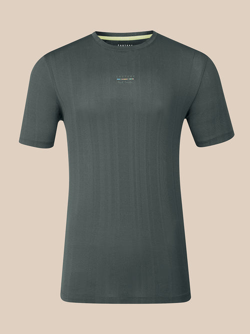 A dark gray short-sleeve crewneck t-shirt with a subtle vertical ribbed texture and a small multicolor logo on the left chest, displayed against a solid beige background.