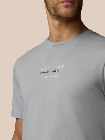 Gray t-shirt with a brand logo on a beige background
