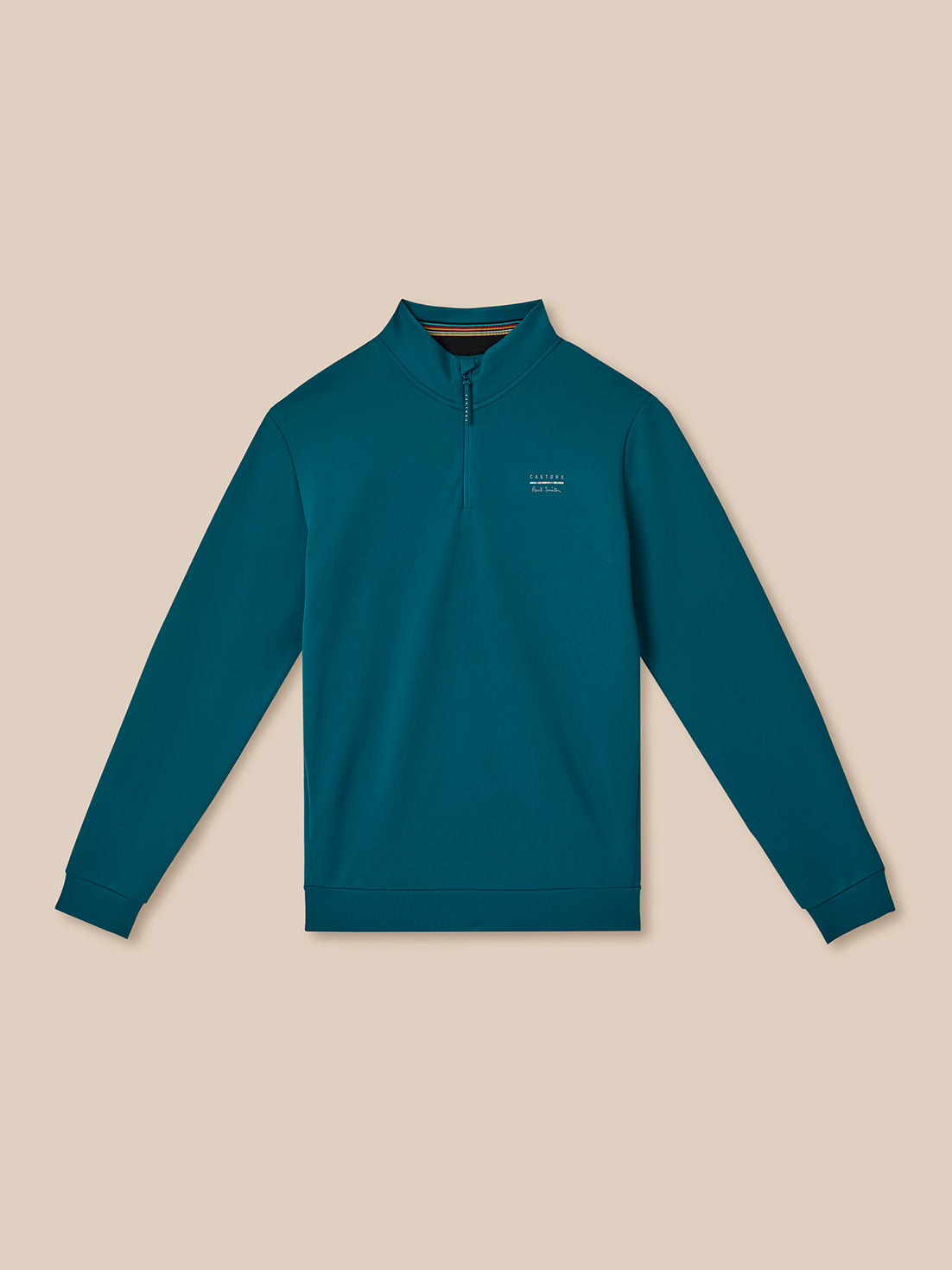 Teal long-sleeve shirt with a small logo on a beige background