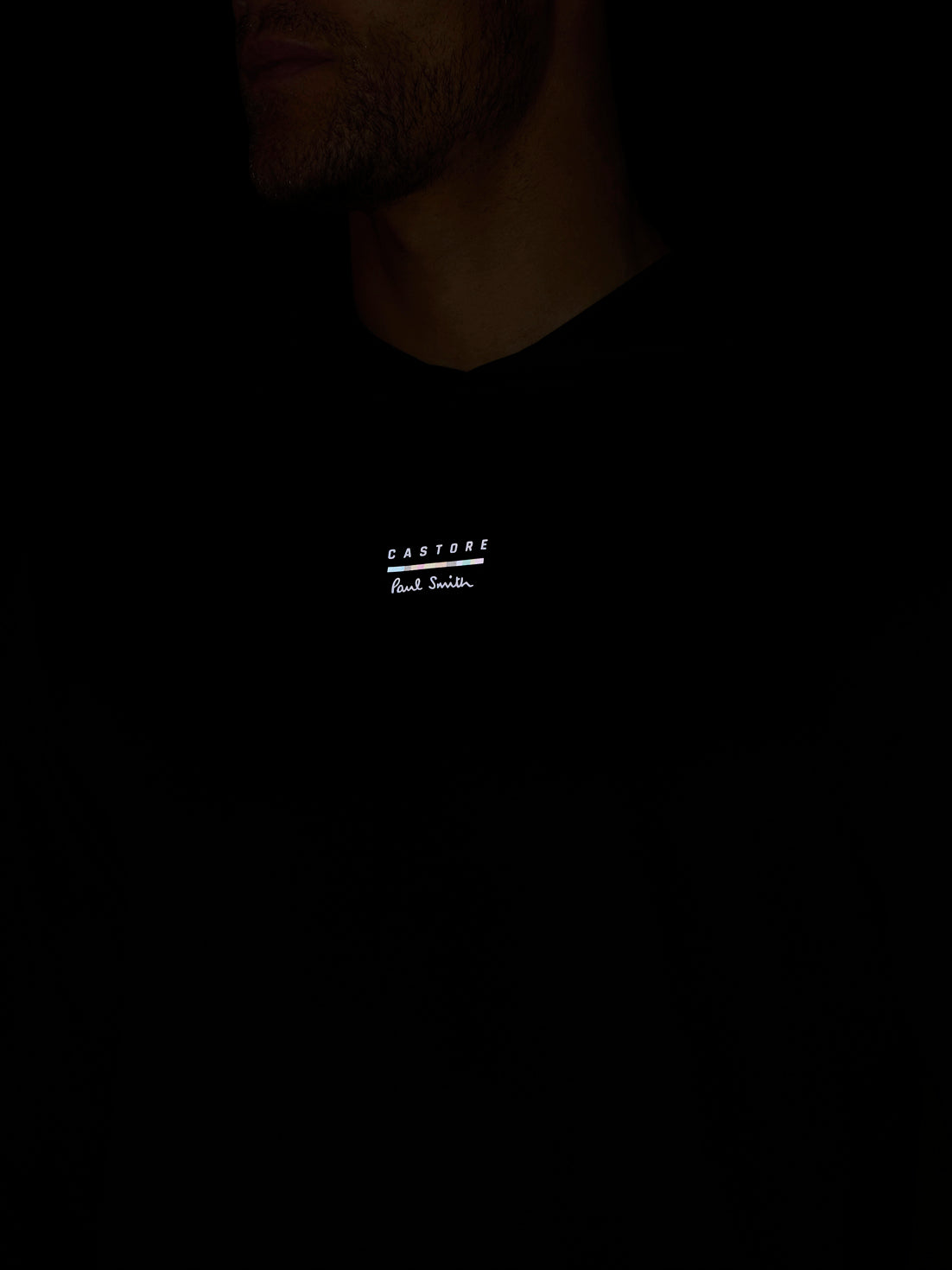 Black t-shirt with white text on a dark background