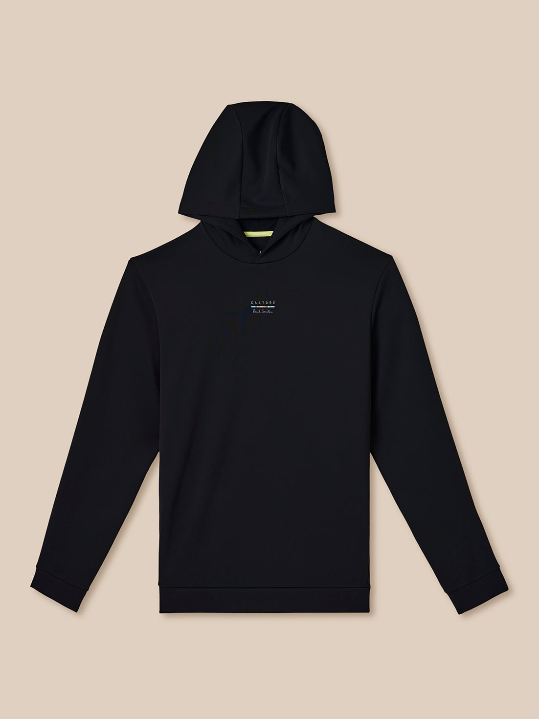 Black hoodie with a small white logo on a beige background
