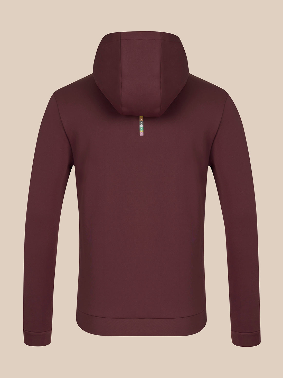 A dark plum-colored zip-up hoodie shown from the back, featuring a small vertical metallic zipper pull with a colorful logo, set against a solid beige background.