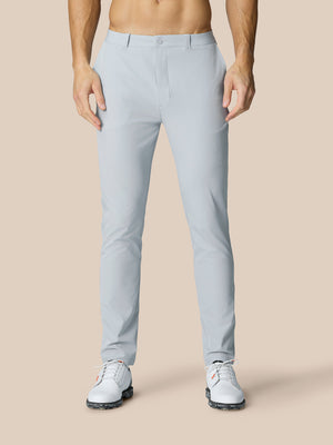 Front view of mid grey Golf Club Trousers on a model highlighting slim fit with belt loops and pockets.