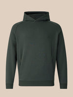A dark olive green hooded sweatshirt with raglan sleeves, displayed on a neutral beige background.