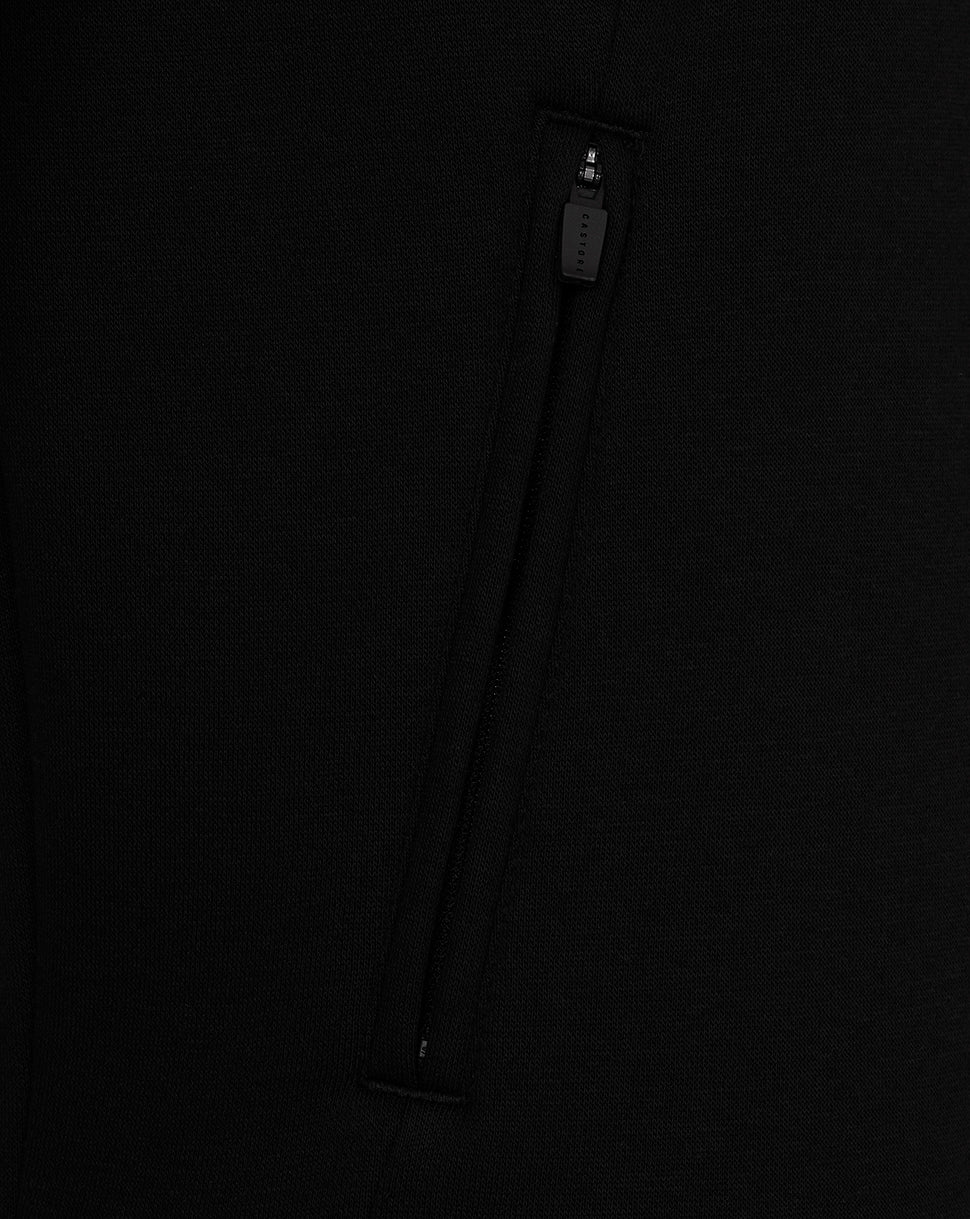 Close-up of a black zipper on a dark background