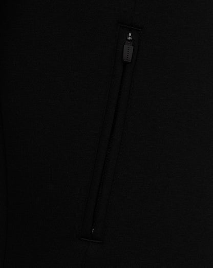 Close-up of a black zipper on a dark background