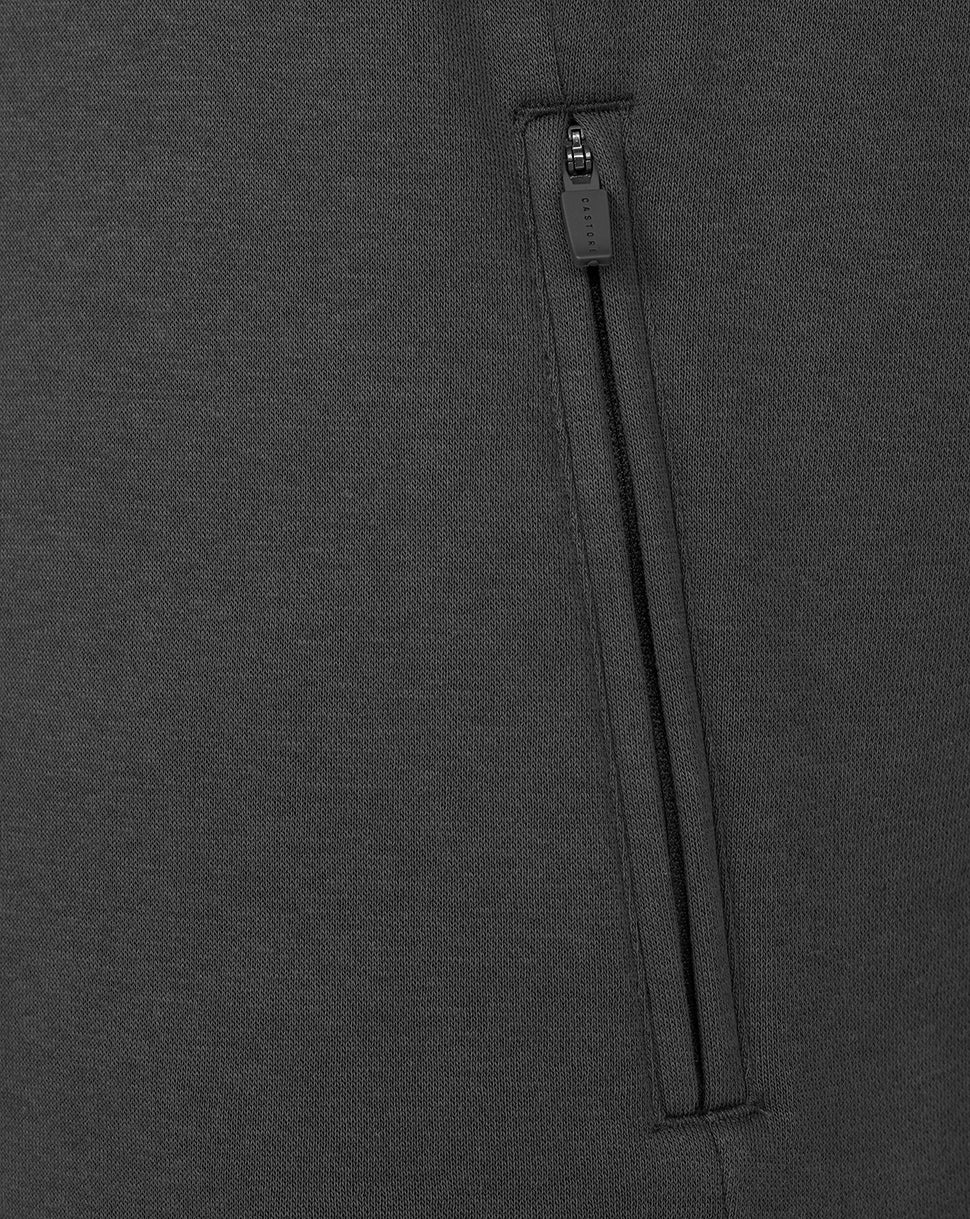 Close-up of a zipper on a dark gray fabric background