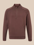 A men's brown quarter-zip pullover sweatshirt with a small tonal embroidered logo on the left chest, displayed on a neutral beige background.