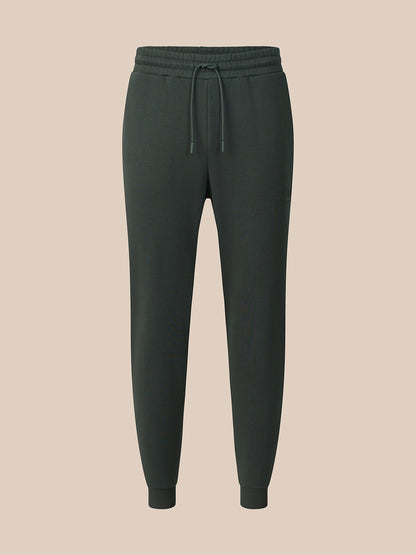 Dark green cargo pants on a white background