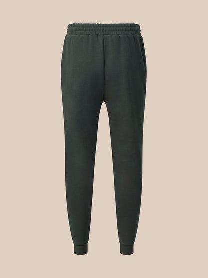 A pair of dark navy blue athletic pants with an elastic waistband, drawstring, and zippered side pockets, shown against a light gray background.