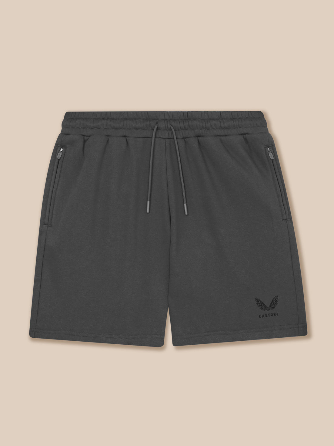 Dark gray shorts with a logo on a beige background