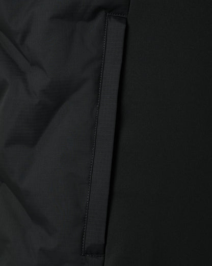 Close-up of a black jacket with a zipper detail