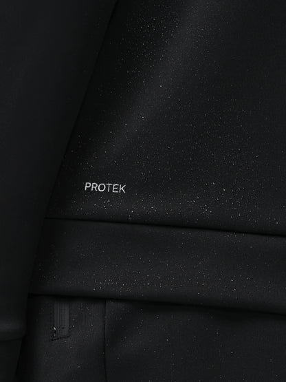 Close-up of a black textured surface with 'PROTEK' branding.