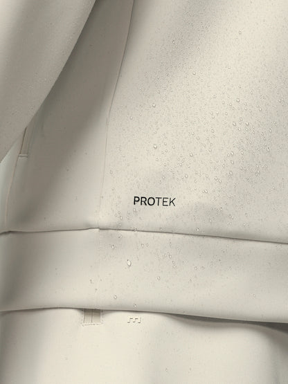 Close-up of a gray fabric with 'PROTEK' branding.
