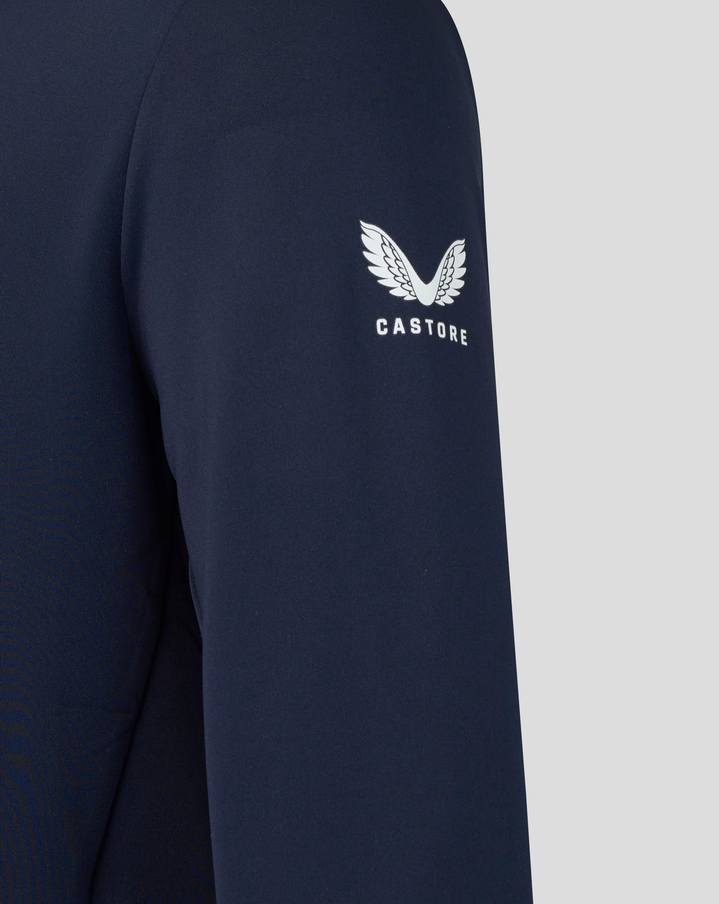 Navy long-sleeve shirt with the Castore logo on a light gray background
