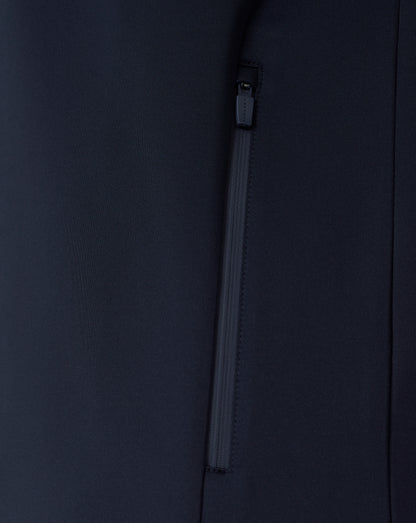 Close-up of a black jacket with a zipper on a dark background